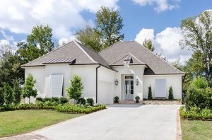 New custom home exterior on 114 Park Oak Court in Belle Chasse, Louisiana. This new construction home has all the bells and whistles such as rear entry garage and double entry doors.