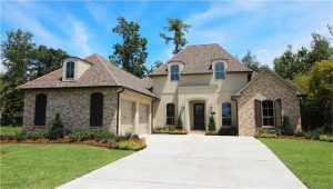 What makes a this fabulous traditional new home is the side entry garage, and massive front entry. The home located at 113 Kellywood Court front exterior has both French providential and traditional architecture. The yard is professional landscaped with many beds around the home.